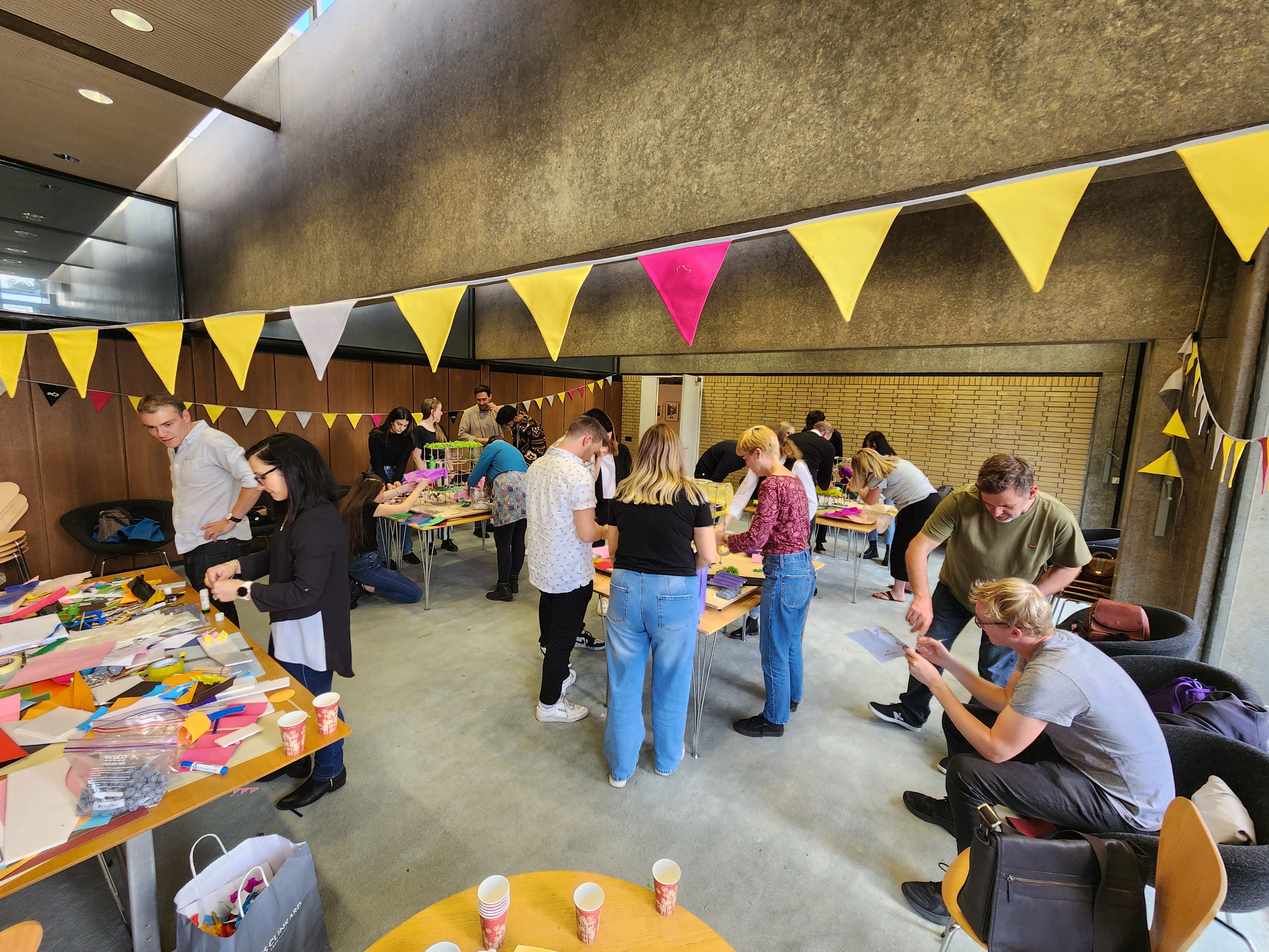 Activities at ADP's All Day Party - groups taking part in crafts inside St Catherine's College